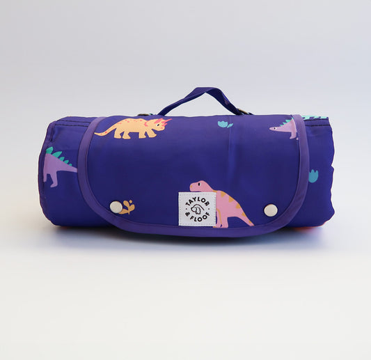 Dino Diva Dog Settle Mat – Purple Dinosaur Pattern – Fun and colourful dinosaur-themed settle mat for dogs, perfect for crate training, travel, and encouraging calm behaviour in any environment.